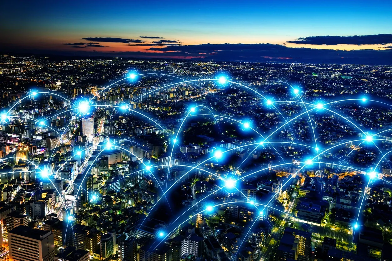 A city at dusk with illuminated network connections
